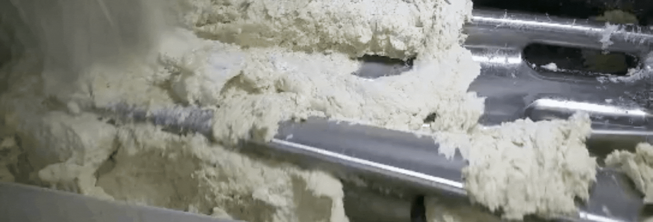 The kneading of dough in a continuous mixer