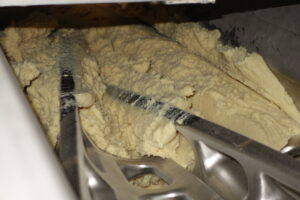 Continuous mixing dough